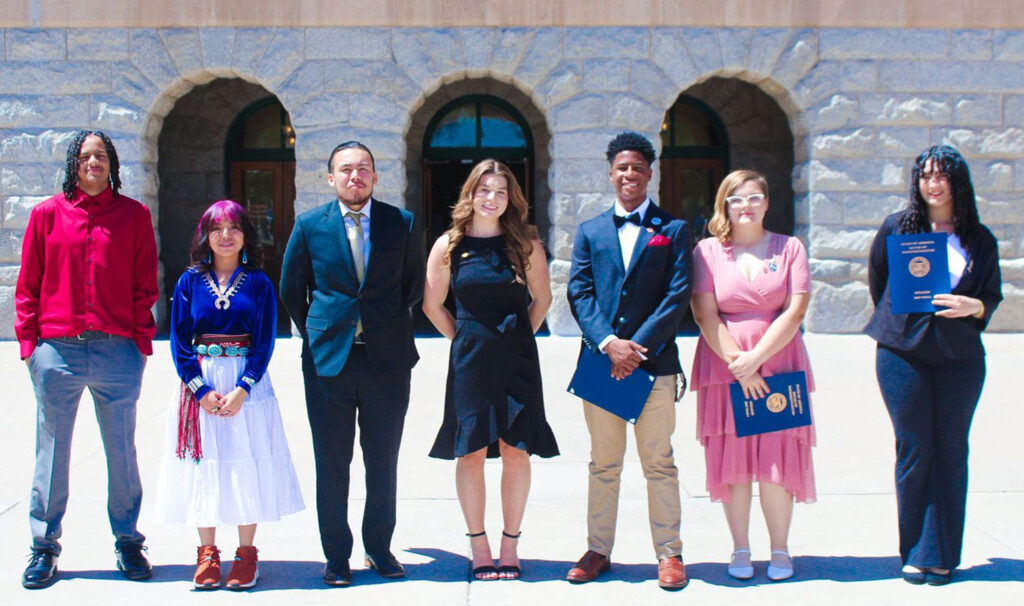Sydney F. (center) the 2024 Arizona State Youth of the Year with 6 finalists in front of the state capitol. 